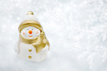 Christmas card with Snowman holding Christmas star. Christmas background with copy space