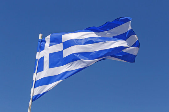 flag of Greece over blue sky