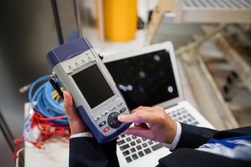 Technician using digital cable analyzer