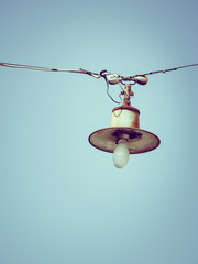 Color filter image/ Old bulb hanging on the sky, Selective focus 