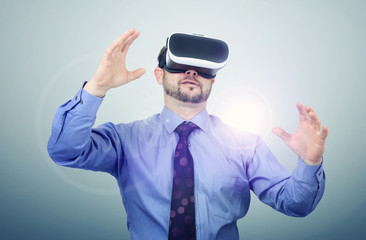 Bearded man wearing virtual reality goggles