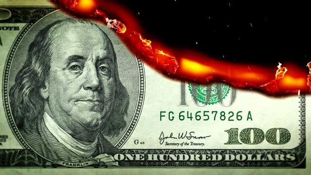 Dollar bill USA money burning in flames