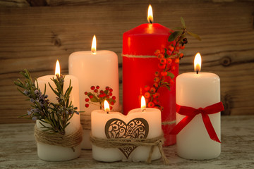 Elegant candles decorated for Christmas