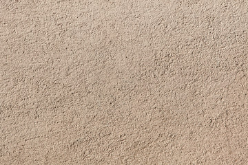 Beige painted stucco wall. Background texture