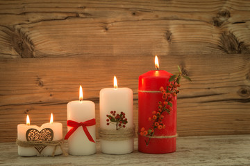 Elegant candles decorated for Christmas