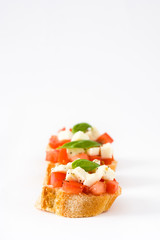 Caprese salad bruschettas isolated on white background

