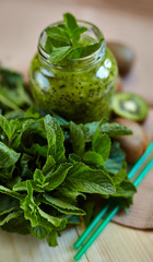 Fresh green smoothie with kiwi and mint . Love for a healthy raw food concept. Healthy eating. Fruit Smoothies. Kiwi.