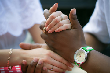 Hands of groom and bride