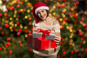 Christmas Santa hat isolated woman portrait hold christmas gift.