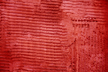 Red textured cement wall