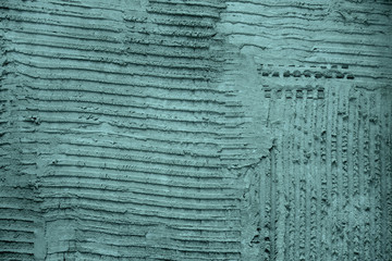 Turquoise textured cement wall