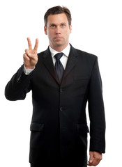 Businessman giving peace hand sign on white