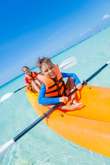 Kids paddling in kayak