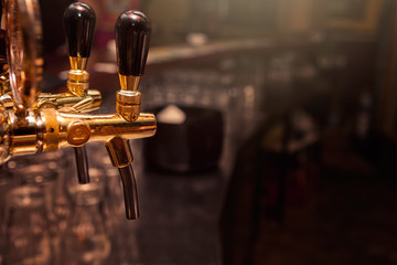 Fototapeta na wymiar Beer tap in the bar