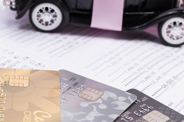 Fototapeta premium Loan Finance Concepts, toy car and credit card with passbook as