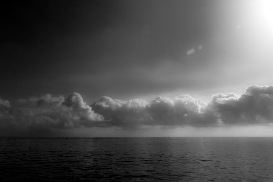 Fototapeta clouds over the sea black and white