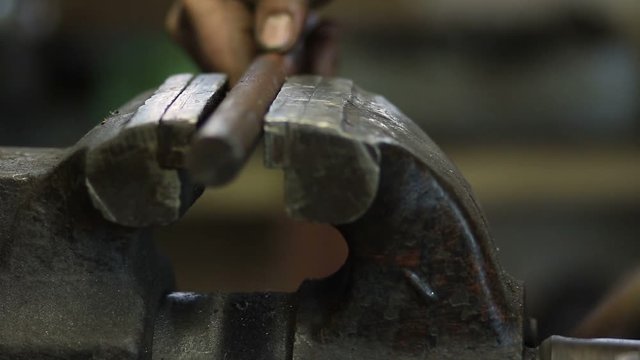 Worker fixing workpiece with clamp equipment