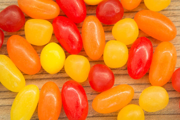 Colorful jelly beans close to wallpaper