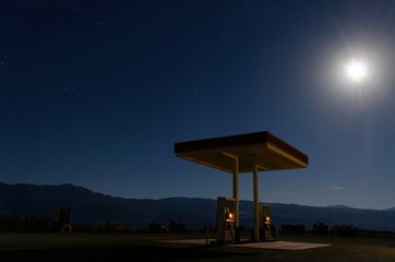 Lonely gas station under moonlight