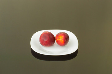 Fresh Organic Peaches in a White Plate