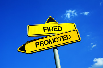 Obraz premium Fired or Promoted - Traffic sign with two options – professional ladder of employee in employment - success and promotion vs failure and firing