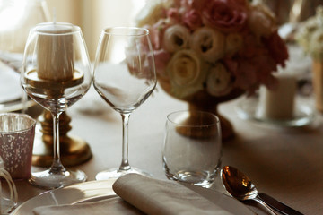 Sparkling glasses stand before rich dinner plate covered with fl