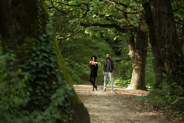 Obraz premium fashionable couple in green forest