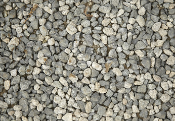A full page of grey gravel driveway background texture