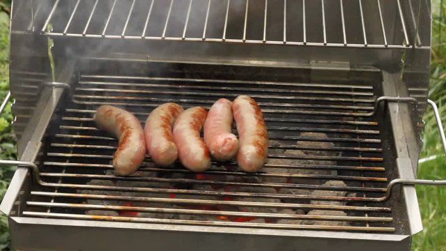 Grilled sausages on a grill