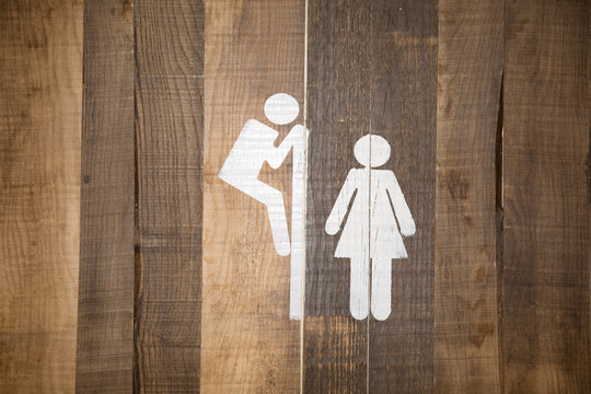 Funny wc restroom symbols man look at woman in toilet