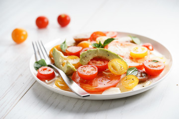Tomato, avocado and red onion salad