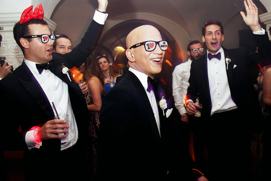 Groom And Groomsmen Dance In Funny Glasses