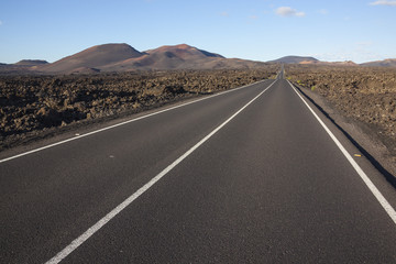 Road through volcanic terrain on the Lanzarote, Canary Islands