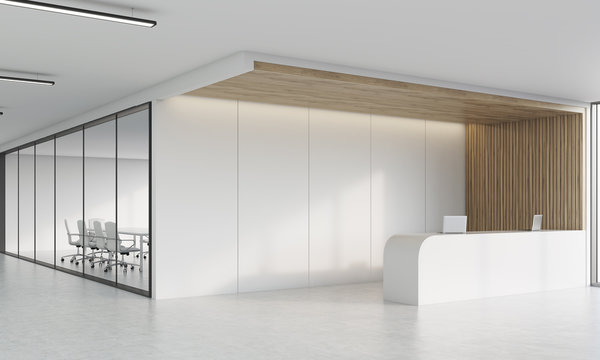 Side view of reception desk and meeting room in corridor