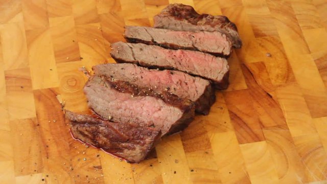 Season a cut filetsteak fresh from the grill