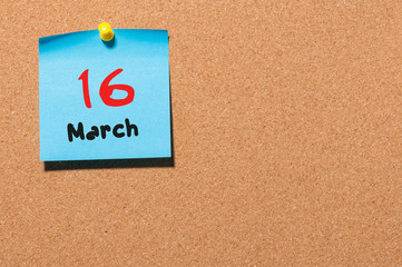March 16th. Day 16 of month, calendar on cork notice board background. Spring time, empty space for text