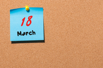 March 18st. Day 18 of month, calendar on cork notice board background. Spring time, empty space for text