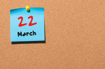 March 22nd. Day 22 of month, calendar on cork notice board background. Spring time, empty space for text