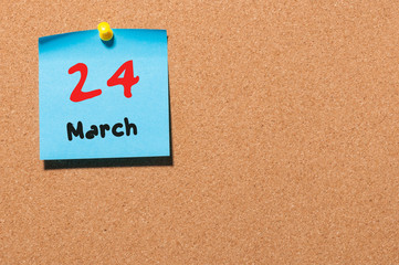 March 24th. Day 24 of month, calendar on cork notice board background. Spring time, empty space for text