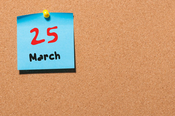 March 25th. Day 25 of month, calendar on cork notice board background. Spring time, empty space for text