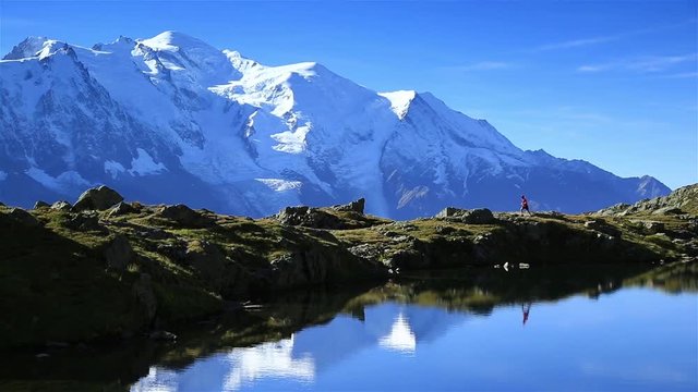 Athlete trail running at Lac De Ch&eacute;serys, near the Mont Blanc. Chamonix, France.