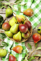 Ripe pears on grey wooden table