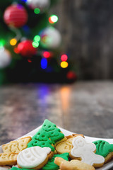 Fototapeta na wymiar Christmas cookies and Christmas tree on wooden background
