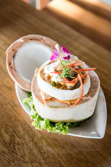 Curry Streamed Seafood in Coconut Cup