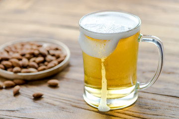 Beer in mug glass on wood table,top view