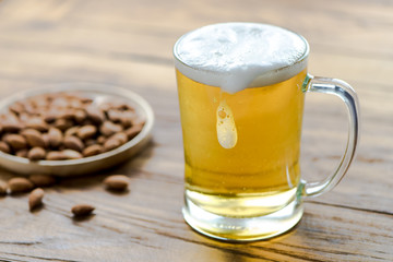 Beer in mug glass on wood table,top view