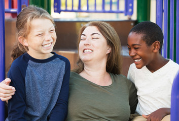 Family laughing together at park