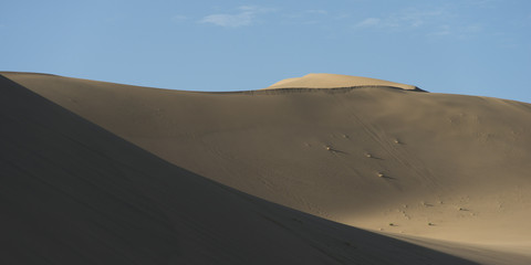 Fototapeta na wymiar Singing sand dunes at Mingsha Shan, Gobi Desert, Dunhuang, Jiuqu