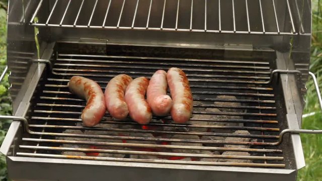 Grilled sausages on a grill
