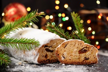 Stollen in icing sugar with colored bokeh